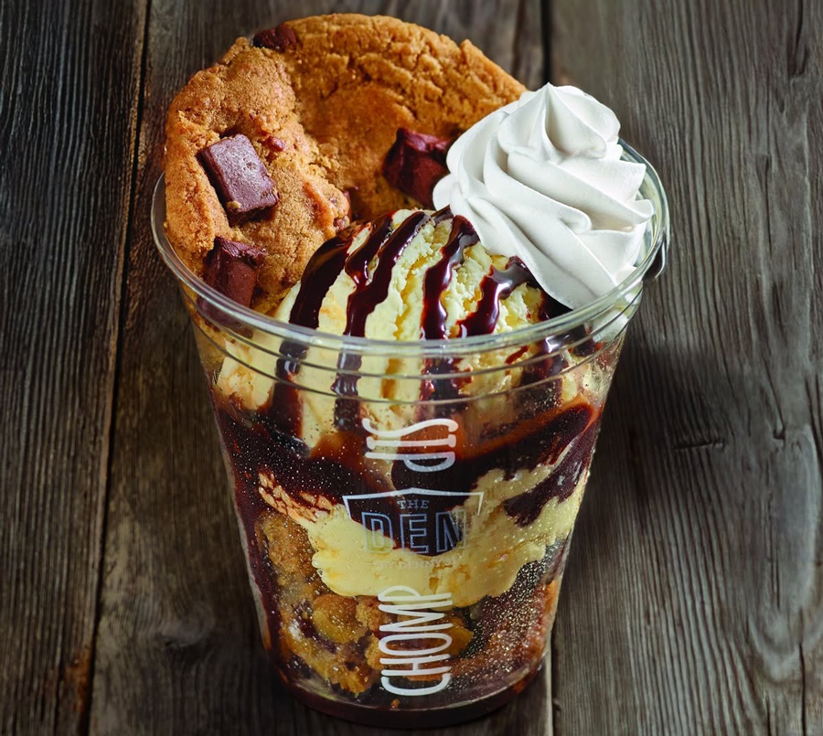 a dessert of cookies and icecream in a cup served at the den 
