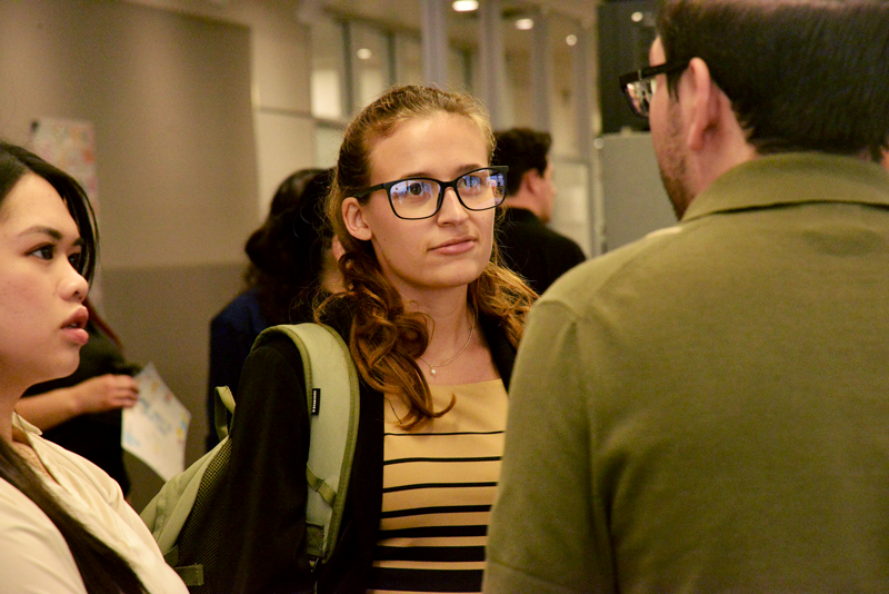 an architecture student talking to a professor 