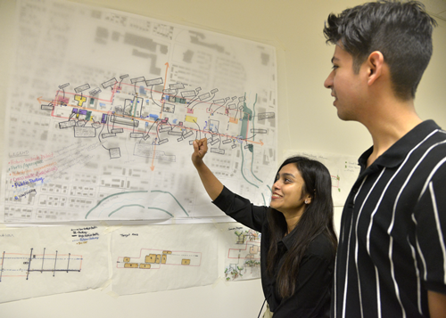 two students working on a flowchart