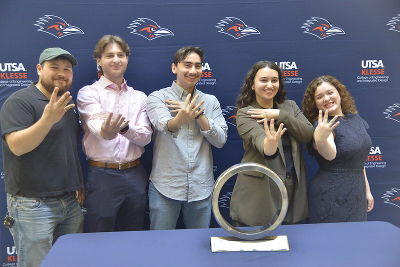Students showing off their brand new rings.