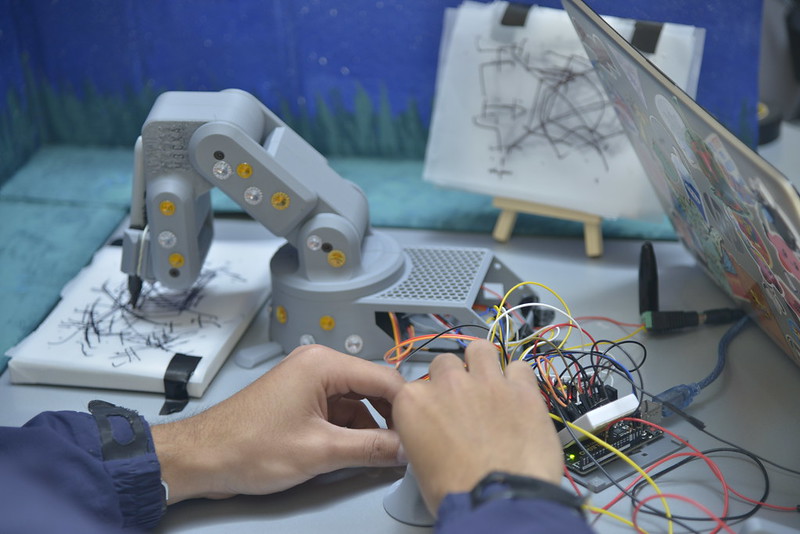 An event participant working on a robotics project