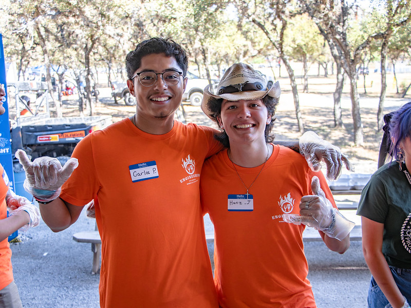Students participating in the BBQ event
