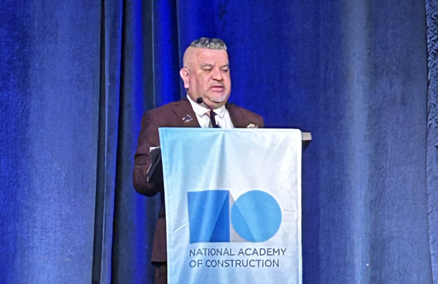 Santino Medina speaking at a podium 