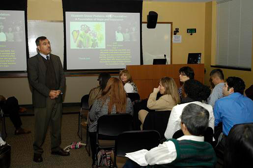 Sunil Ahuja presenting in front of audience