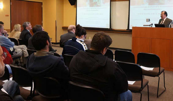 Vivek Nerurkar presenting in front of audience