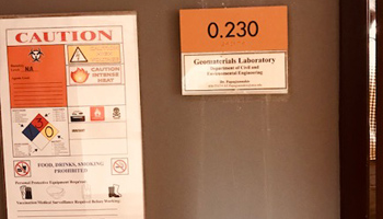 Lab Door with a caution sign