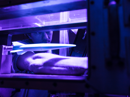 Hypersonics Lab students with a wind tunnel used to conduct research related to hypersonic flight