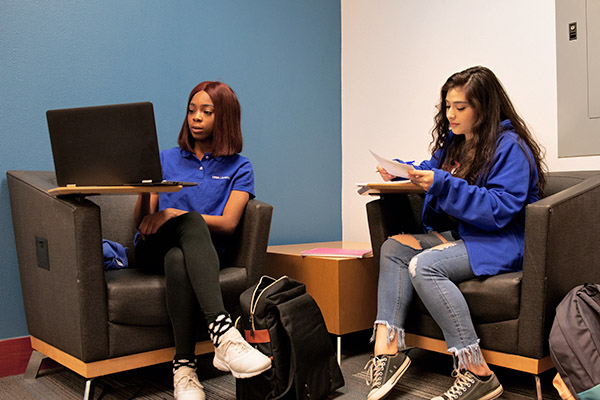 Students studying in engineering library lobby
