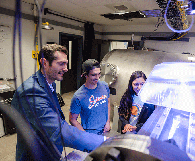 Chris Combs works with students in the Hypersonics Lab.