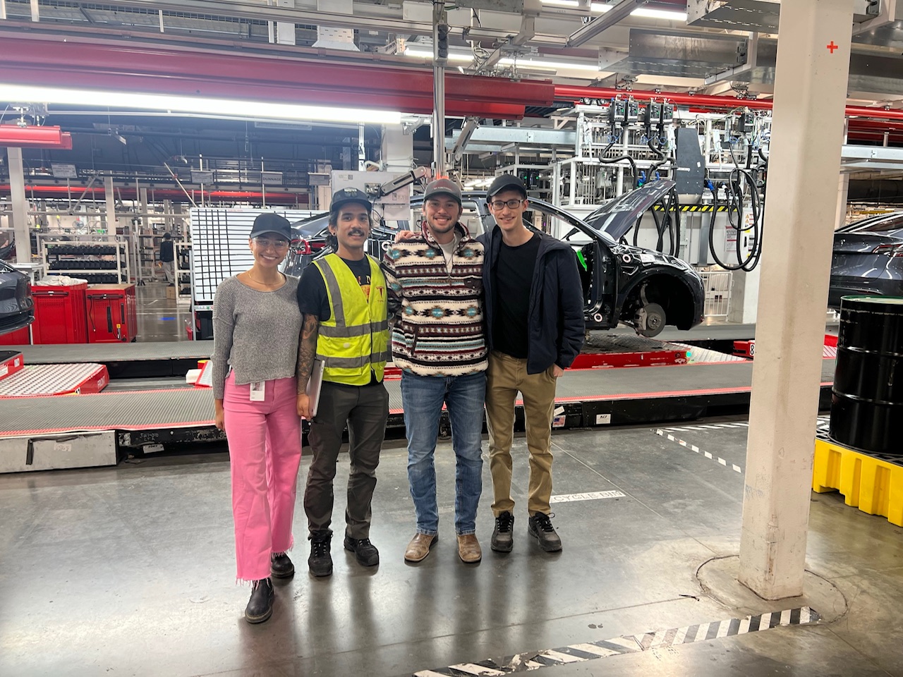 Christian and colleagues at a car manufacturing plant