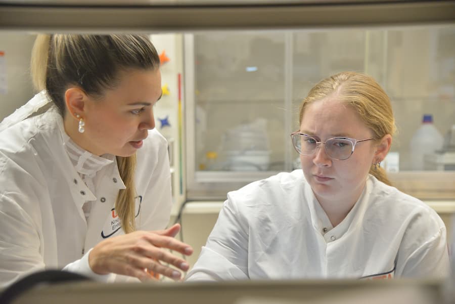 Dr. Gonzalez Porras working in the lab with another researcher