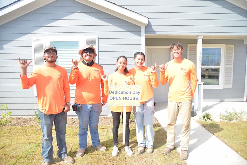Student interns from UTSA helping out at Habitat for Humanity.