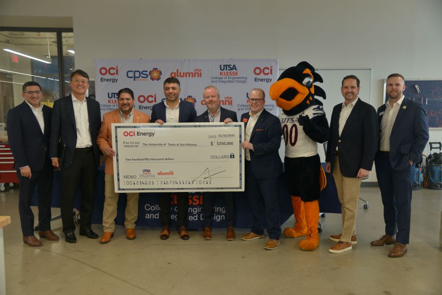 Rudy Garza, CPS Energy CEO, OCI Energy representatives, UTSA faculty, and Rowdy the Roadrunner pose with a $250,000 check at the UTSA check presentation event.