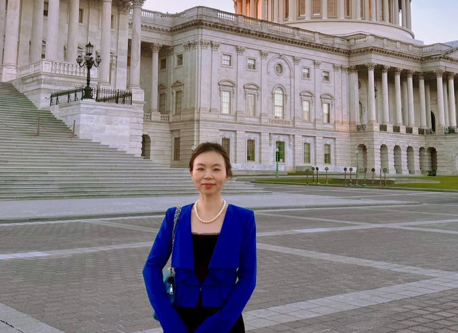 Guen Chen in front of the capitol building