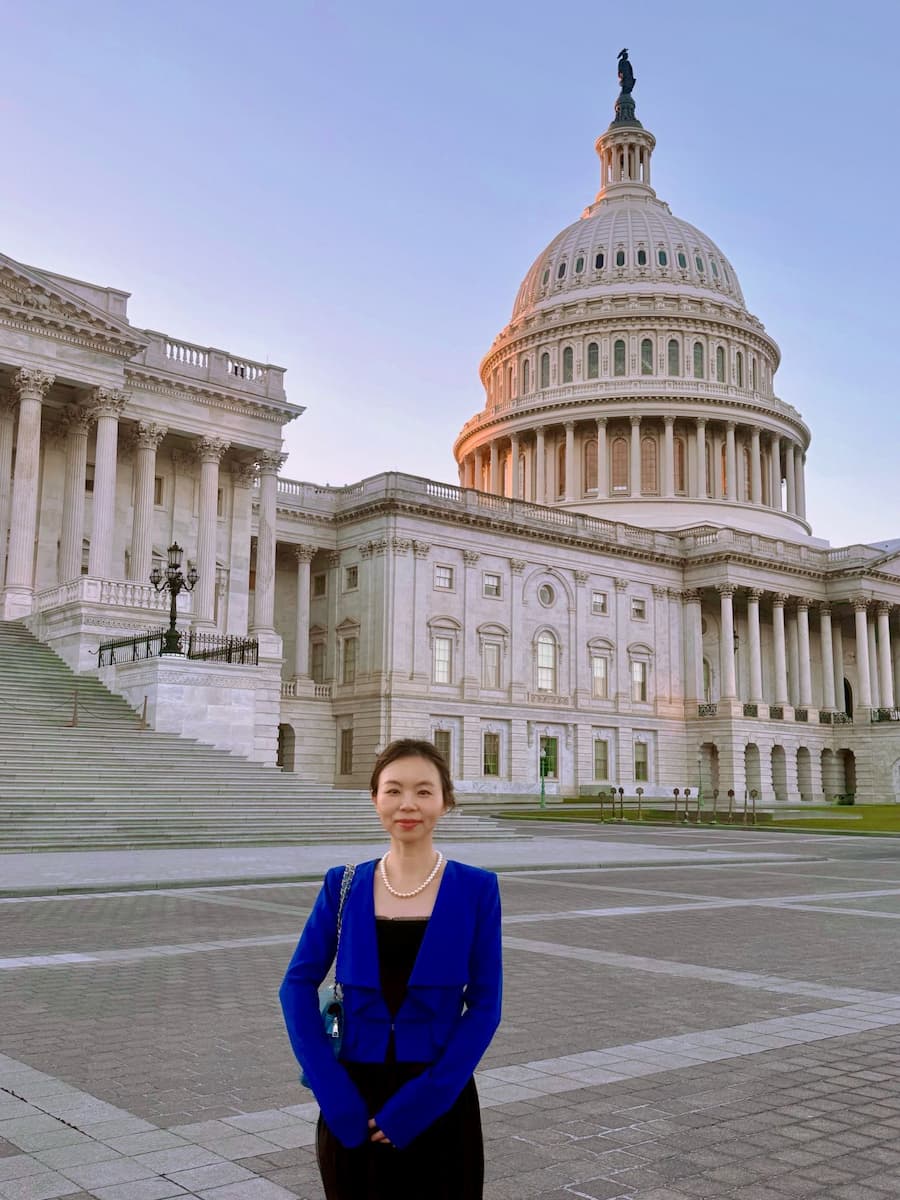 Guen Chen in front of the Capitol Building