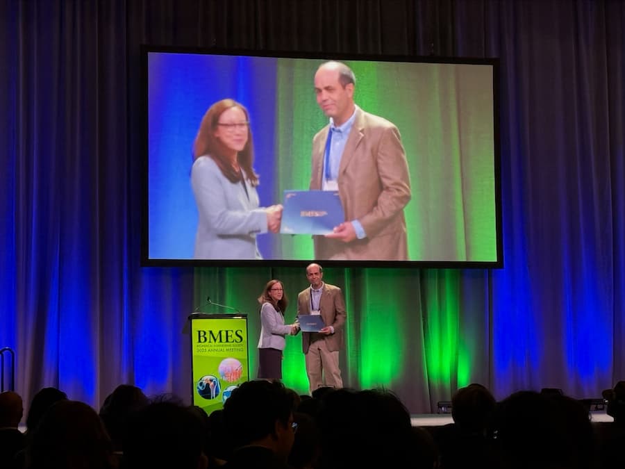 Finol receiving his award on stage.