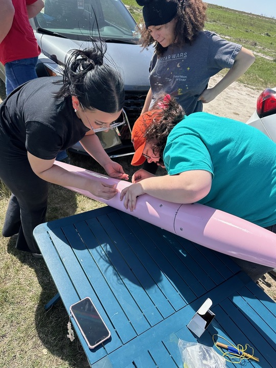 The team prepping their rocket for launch.