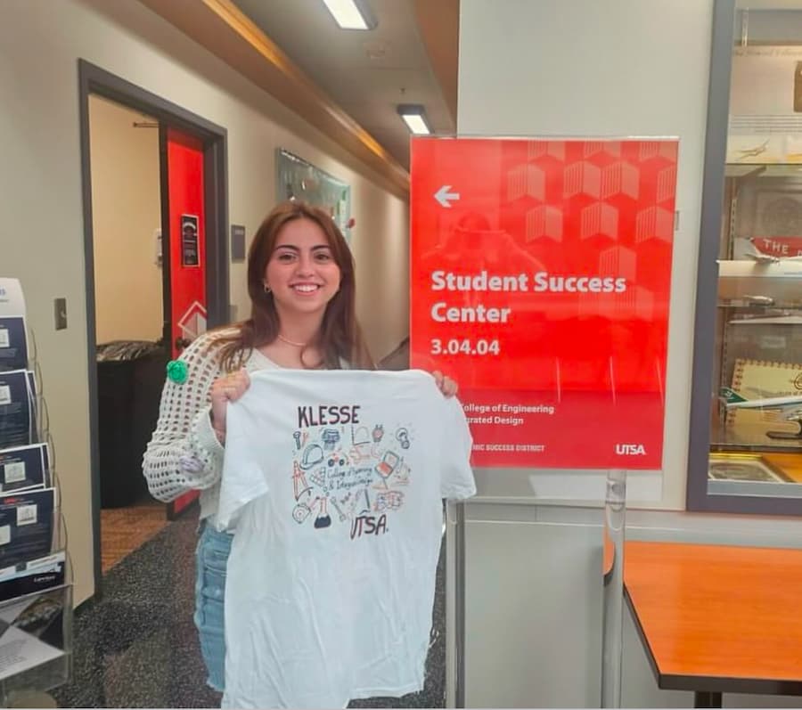 Kaylee with her winning design for the Klesse College T-Shirt Design competition.
