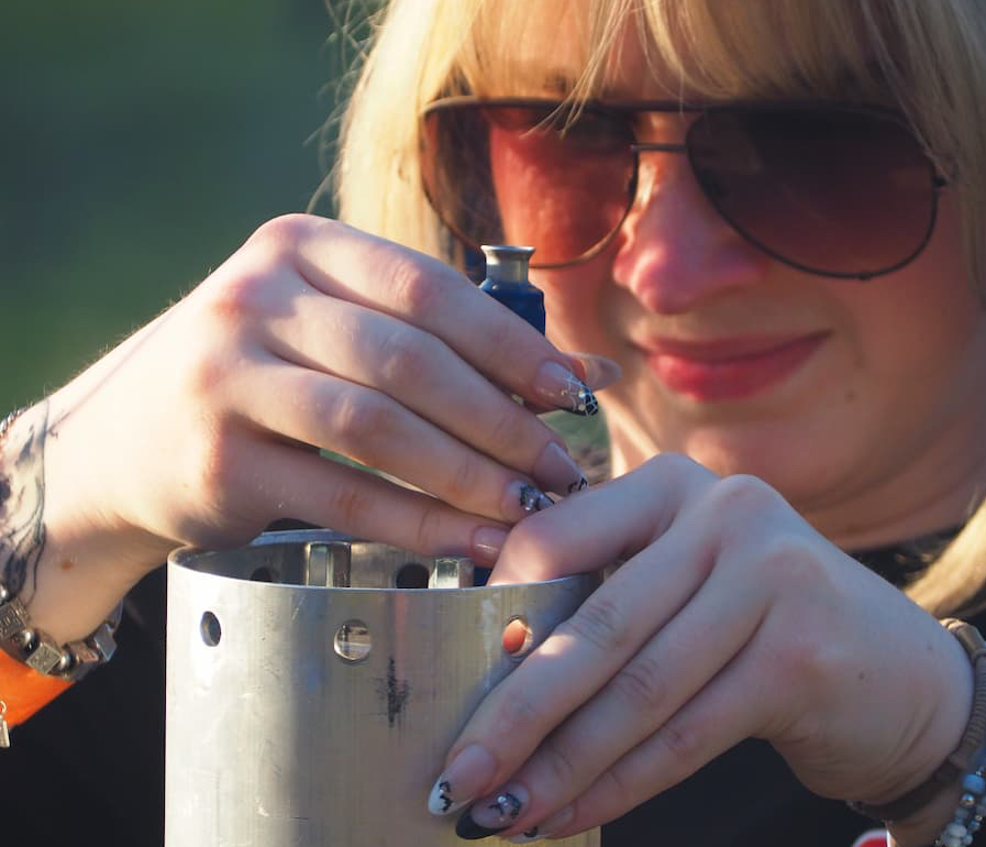Mechanical engineering major, Grace Zimmer, working on a component of the rocket.