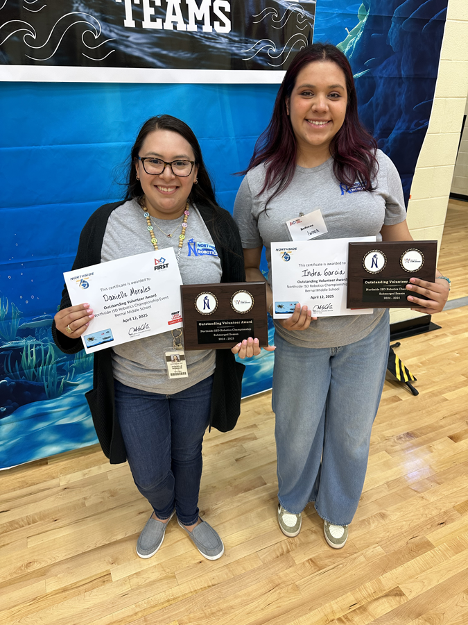 ndra Garcia-Morales and Danielle Morales smile while holding their Outstanding Volunteer Award certificates and plaques at the NISD Robotics Championship event on April 12, 2025.