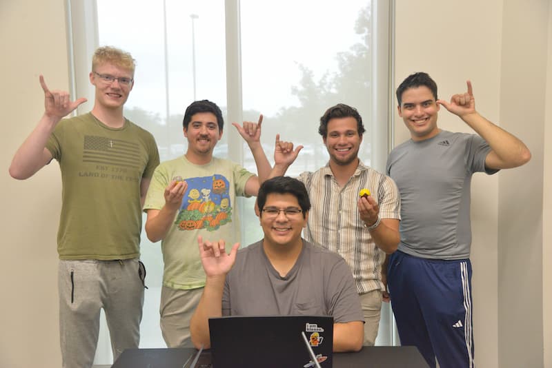 The TaijiToy Team gives a birds up as their Senior Design I project comes close to competition at the Tech Symposium