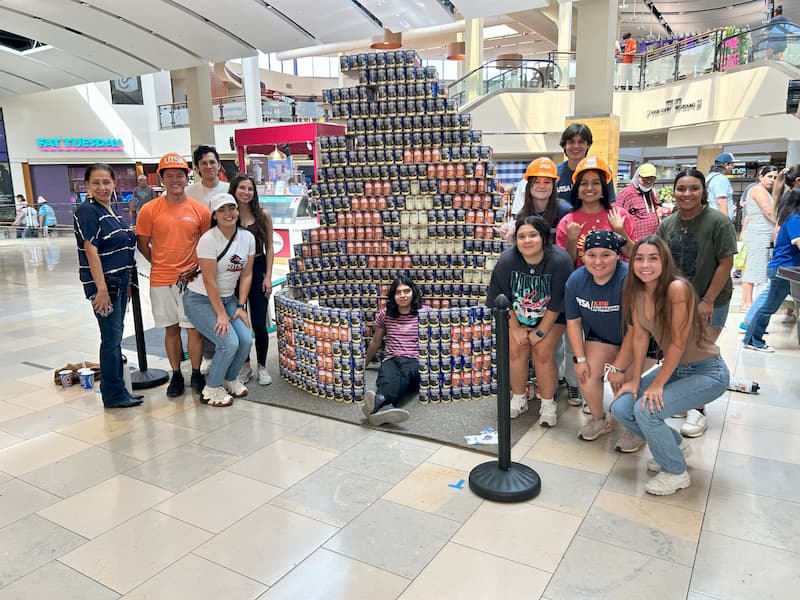 My Le with other volunteering members of the American Institute of Architecture Students participating in Canstruction, a friendly design competition to raise awareness on food insecurity and Hunger Awareness month at Northstar Mall.