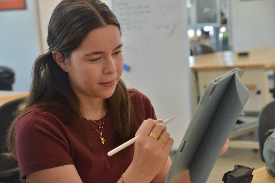 Team member, Alba Chocron, working on an element of their device.
