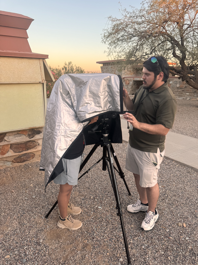 Isaac Knott with Daniel Serna (under the dark cloth of their large format camera) 