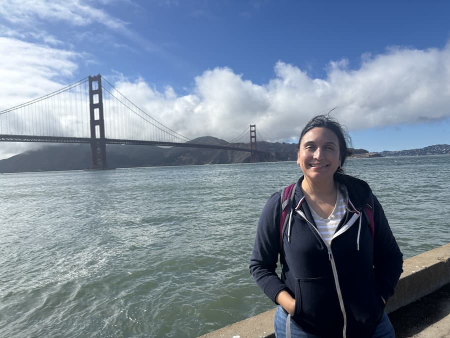 Zenia Hernandez in front of the Golden Gate Bridge
