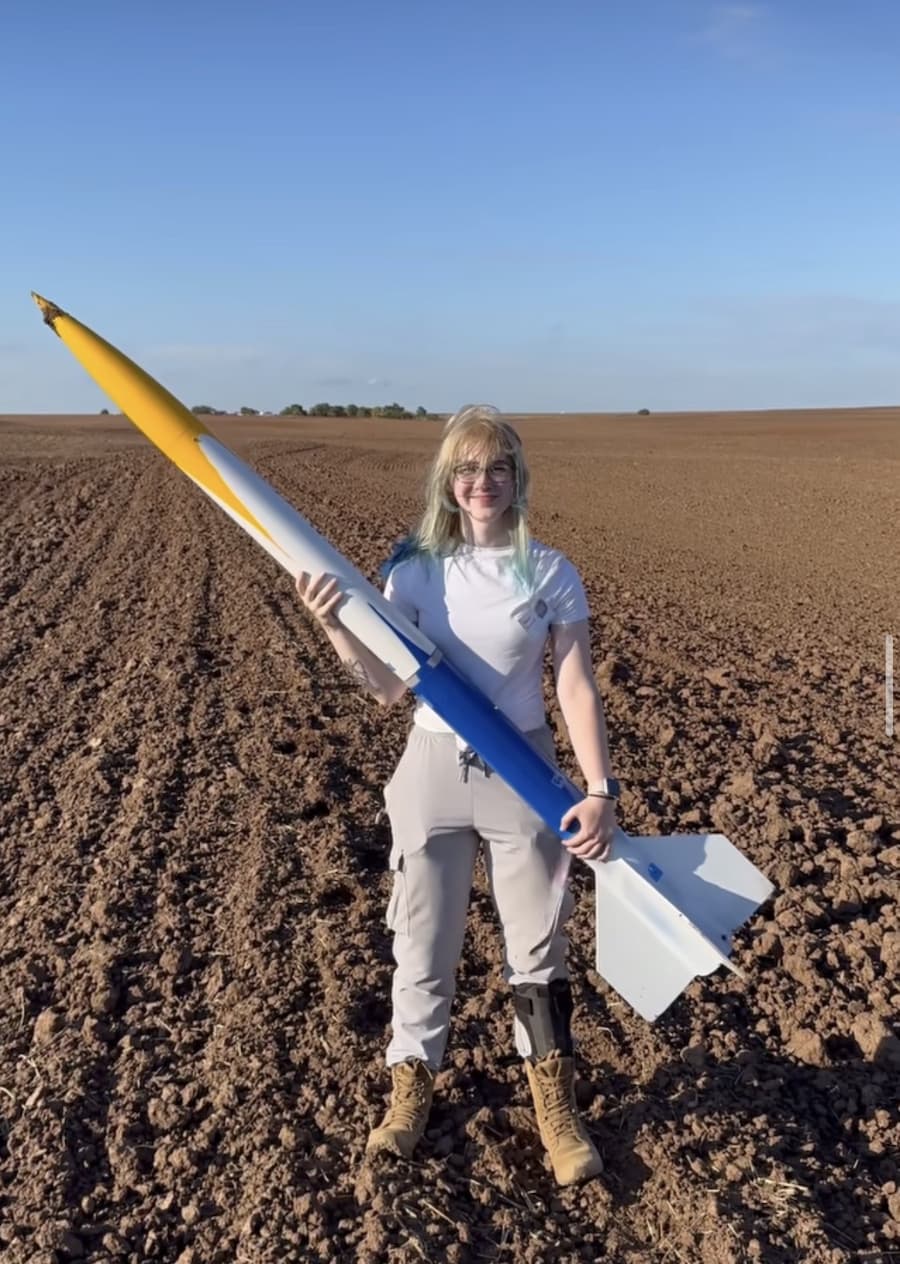 Grace Zimmer holding a rocket.