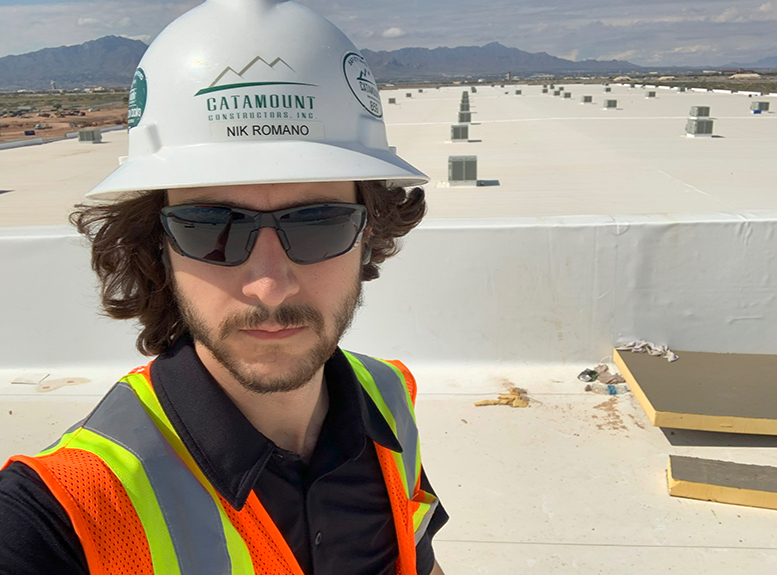 Nik Romano inspecting a roof in Denver, Colorado