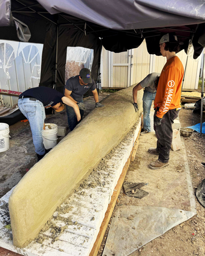 Students building a canoe