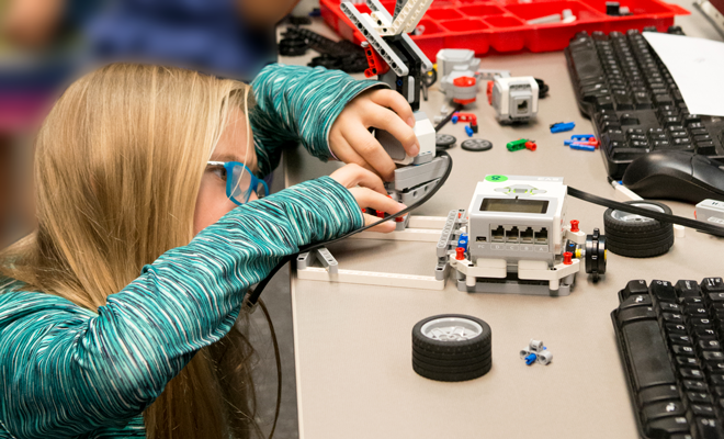 middle school learner working on a robotics project at UTSA summer camp