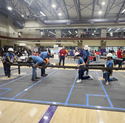 Students working on the steel bridge competition